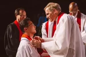 Pastor Kee with Bishop Shol during his ordination